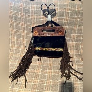 Myra sunflower purse with tooled sunflowers. Black hair on hide.